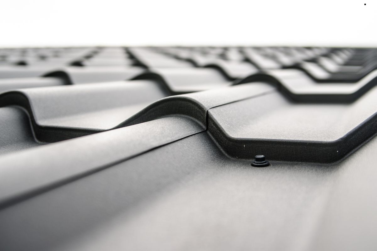 Close-up view of a metal roof showcasing a durable metal roofing system, highlighting quality roofing services.